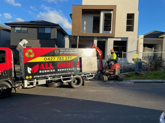 company's truck removing construction rubbish